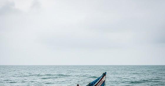 An Image created by AI depicting a boat capsize in the Ocean.